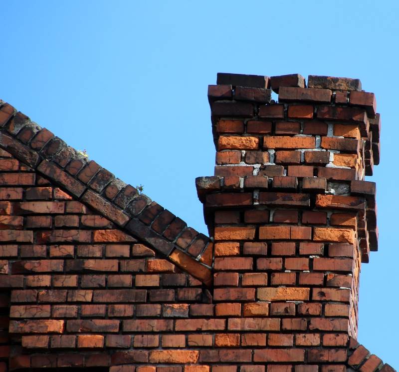 Damaged chimney on an La Mirada home showing cracks and missing mortar
